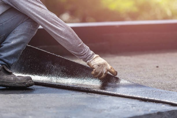 Professional Waterproofing technician working in Holly, MI